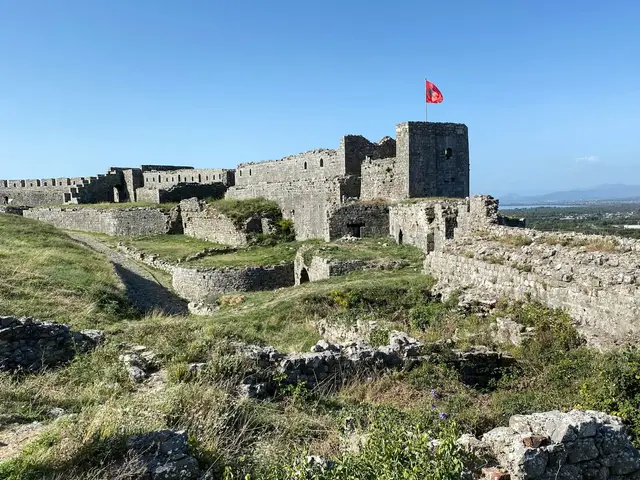 Rozafa fortress and its flag at dusk