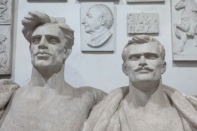 Plaster busts and reliefs in a Tirana sculptor's studio